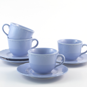 set of four purple cups and saucers