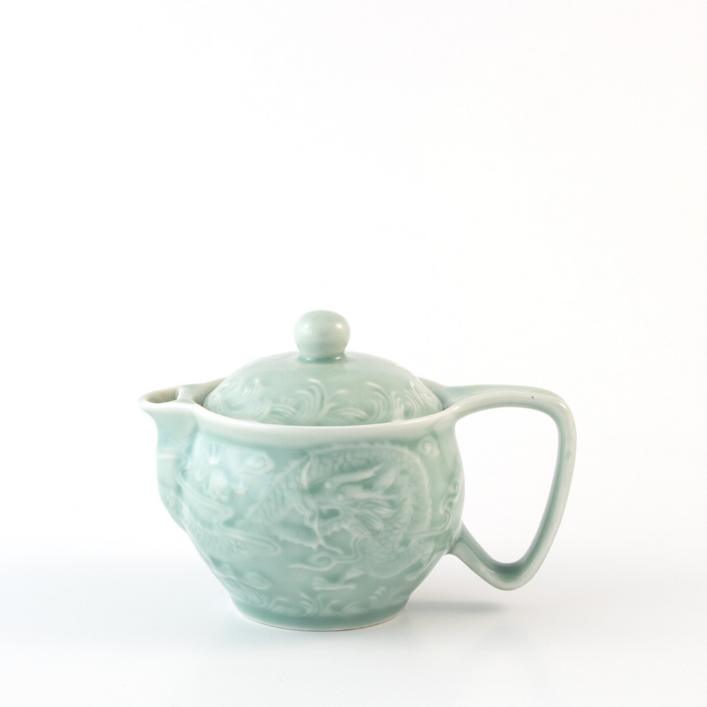 small seafoam green teapot with dragon design