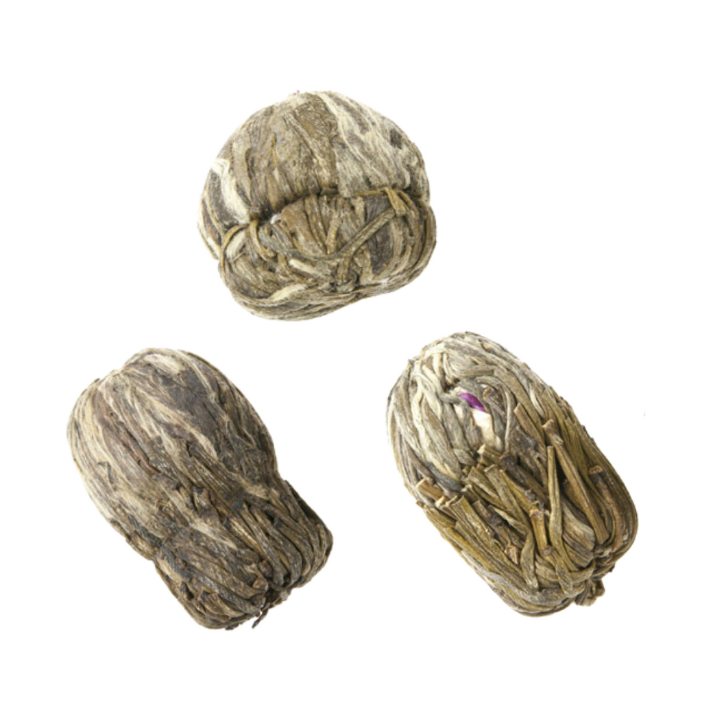 image of three blooming tea balls