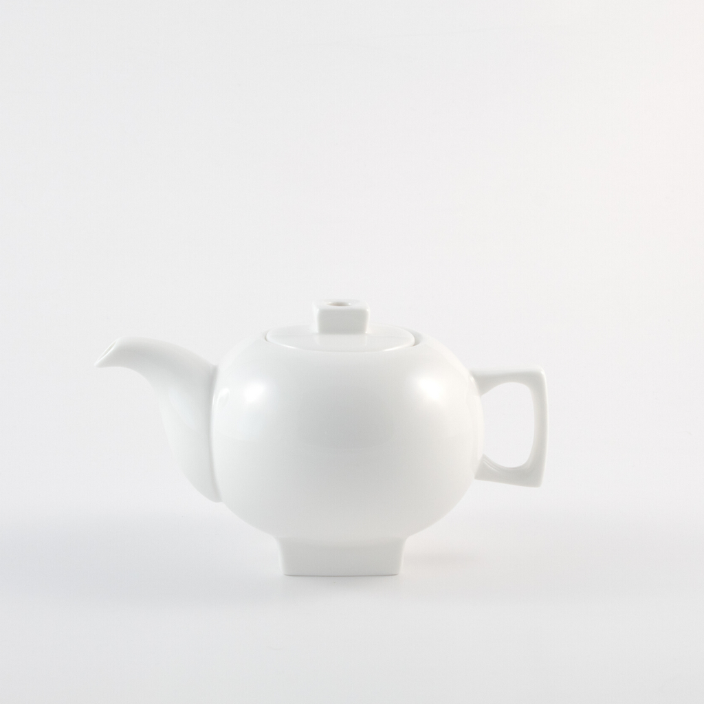 small white teapot with square lid and stand